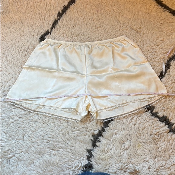 DONNI. Silk Tap Shorts in Light Yellow - Picture 15 of 17